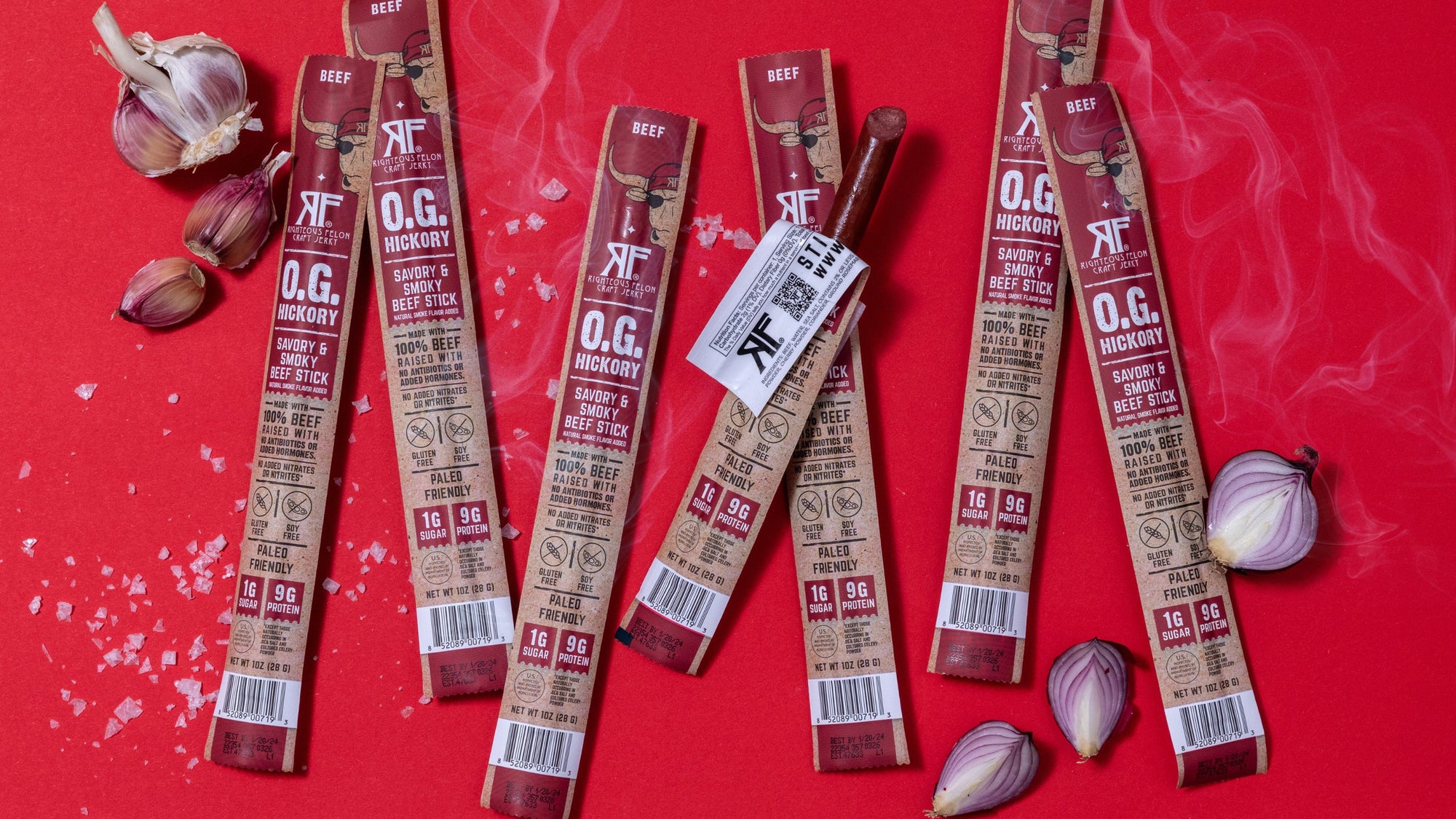 RF O.G. Hickory Beef sticks on red background with ingredients