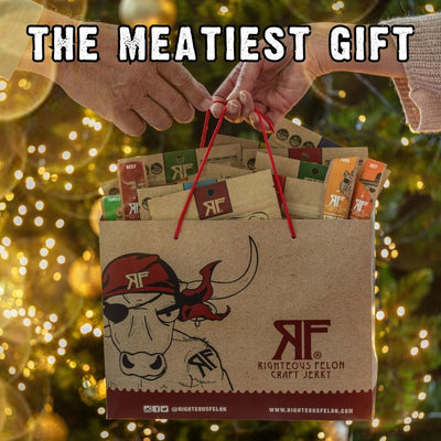 "the meatiest gift", handing off RF gift bag in front of Christmas tree