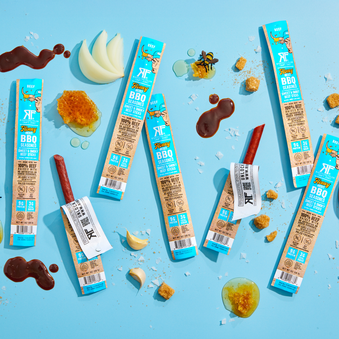 Honey Heist BBQ beef sticks on a blue background