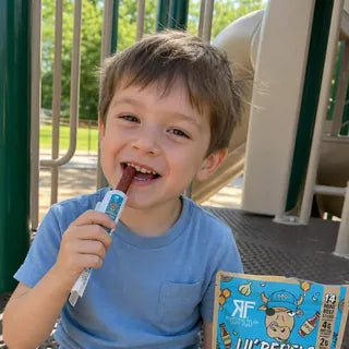 Kid enjoying a Lil' Rebels mini stick