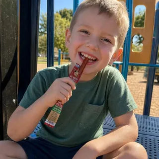 Kid enjoying a Lil' Rebels mini stick